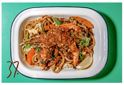LAT 37 A plate of food with noodles and vegetables.